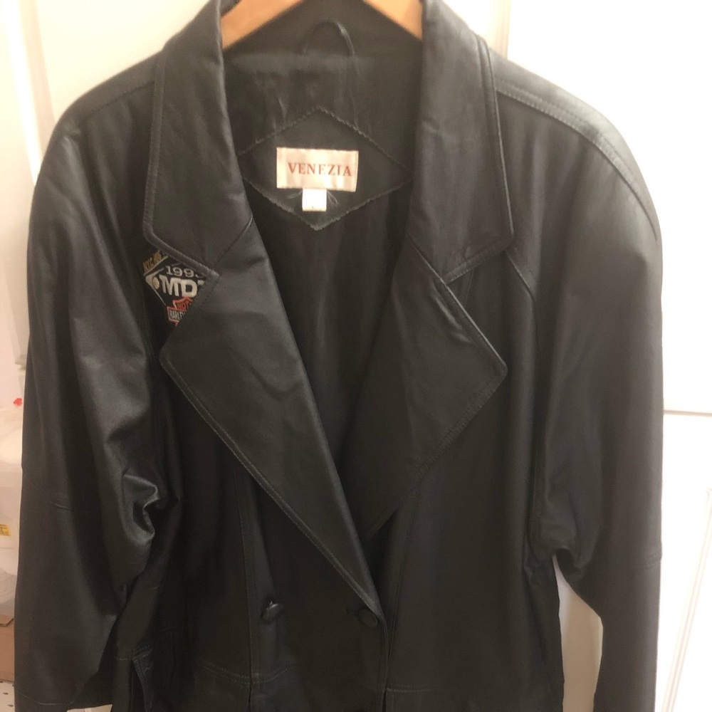 Black long leather coat.